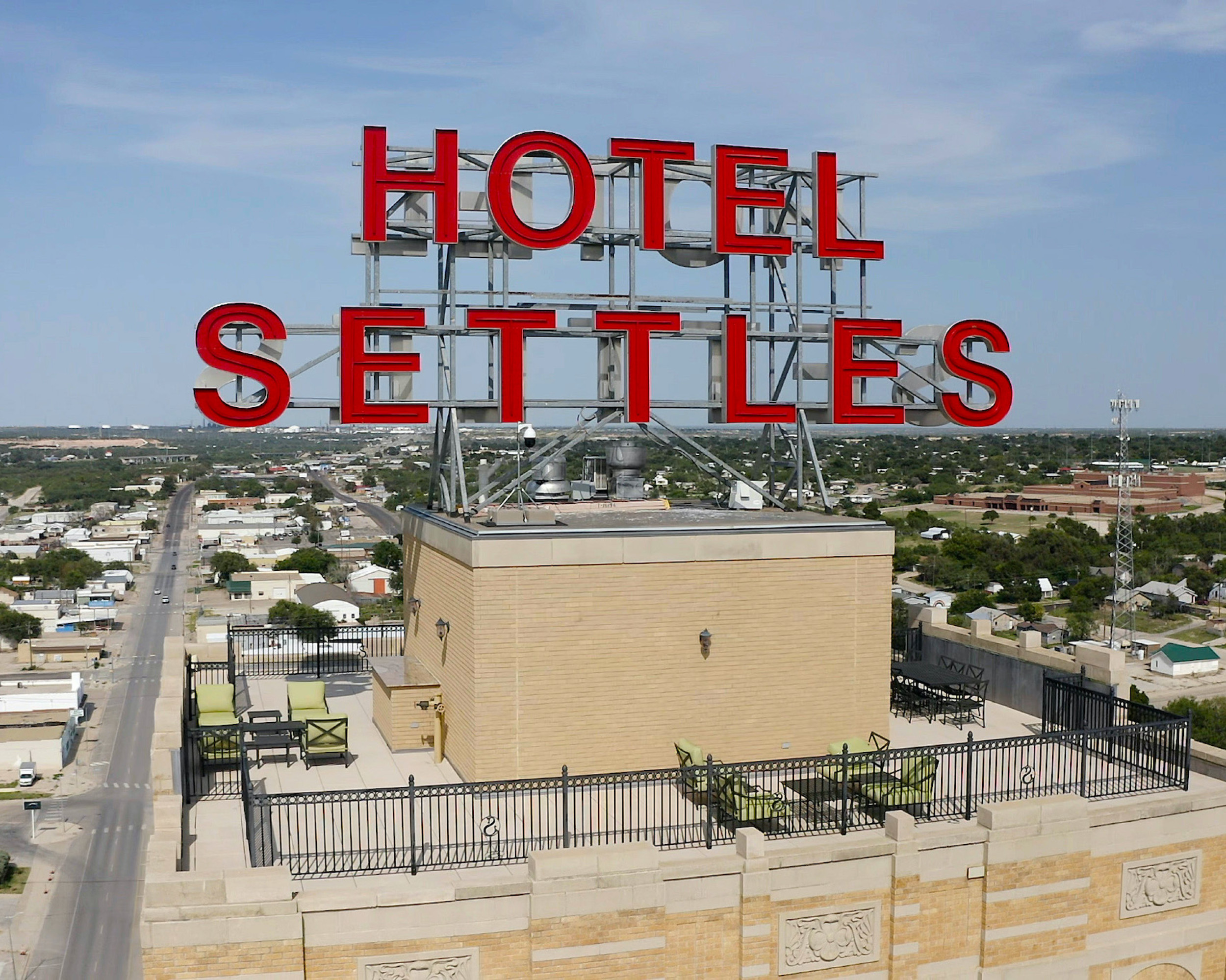 Hotel Settles Sign